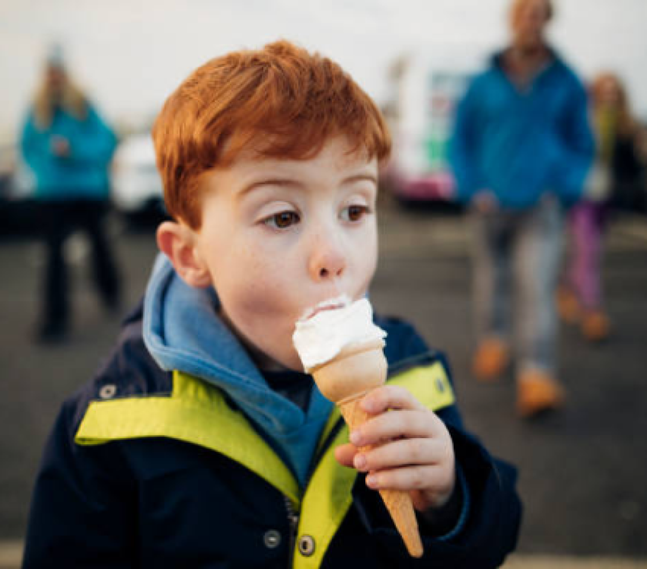Child eating an ice cream.