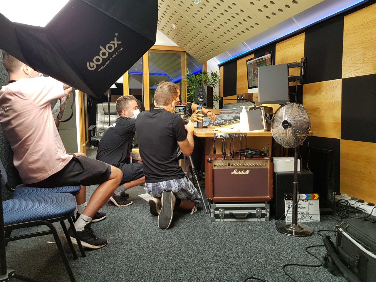 Setting up a scene in a recording studio for the advertisement.