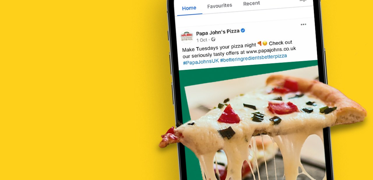 A social media post with a slice of pizza coming out of a phone screen.