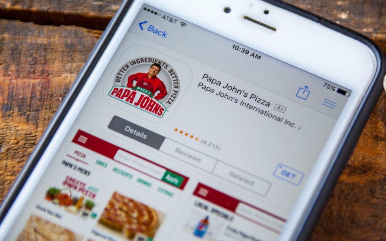 An iPhone with the Papa John's Pizza app store page.